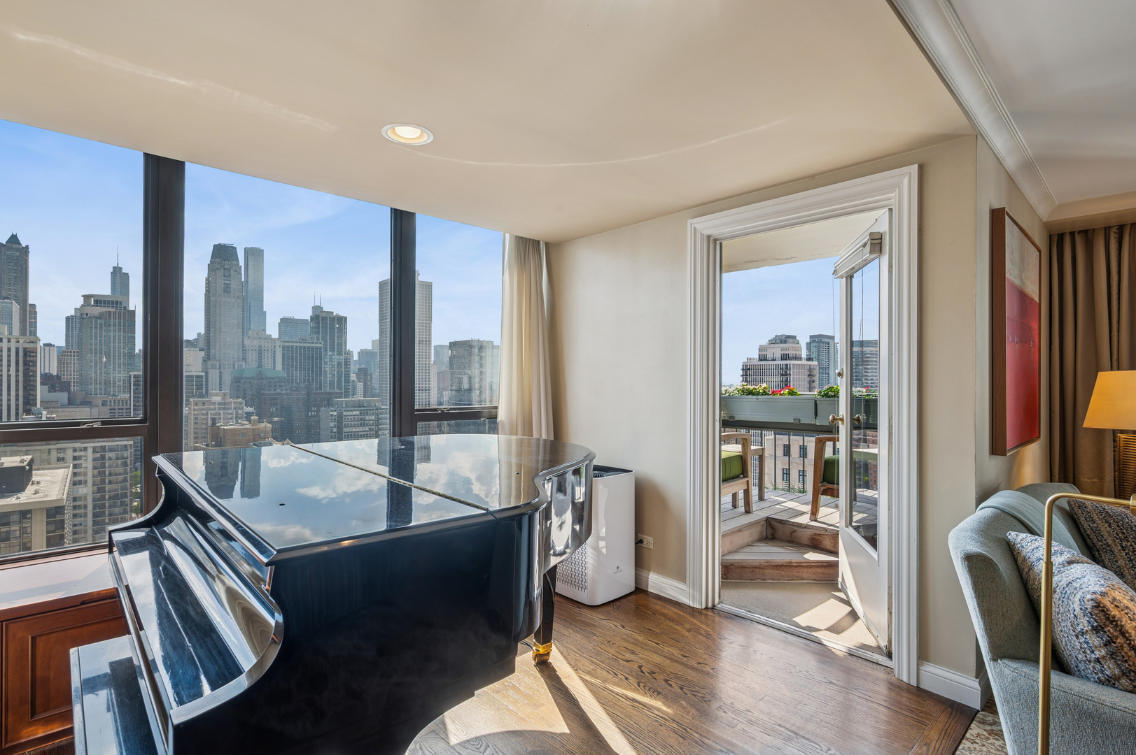1313 North Ritchie Court, Unit 2701 Chicago, IL 60610 - Photo 9 of 33 a living room with furniture and a floor to ceiling window