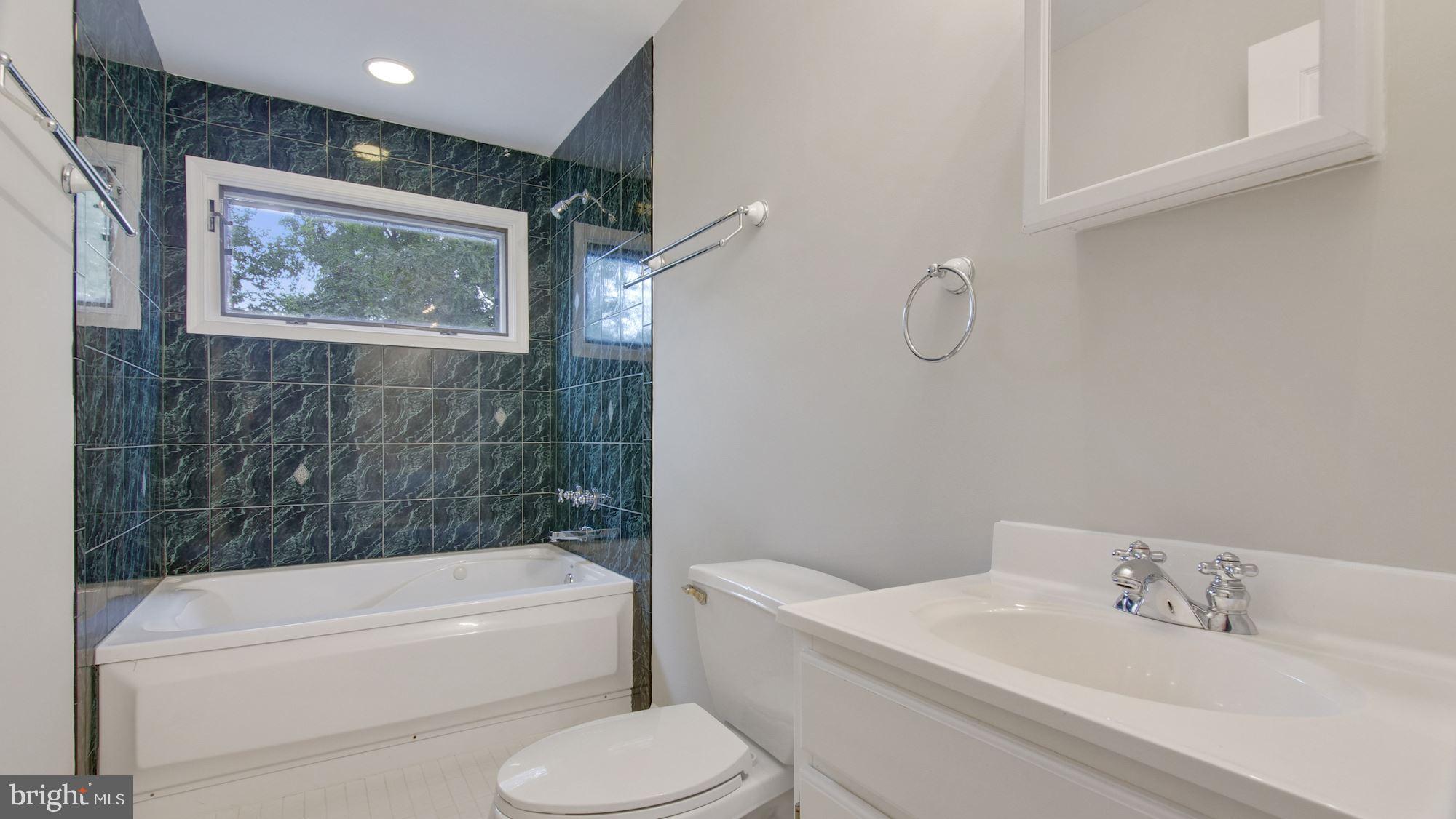 6518 Hackberry Street Springfield, VA 22150 - Photo 35 of 44 Upper level Full Bath with decorative tile