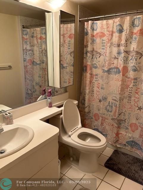 2731 Northeast 14th Street Causeway, Unit 612 Pompano Beach, FL 33062 - Photo 14 of 22 a bathroom with a toilet sink and shower