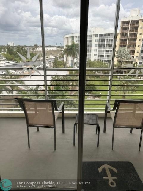 2731 Northeast 14th Street Causeway, Unit 612 Pompano Beach, FL 33062 - Photo 15 of 22 a view of a balcony with chairs