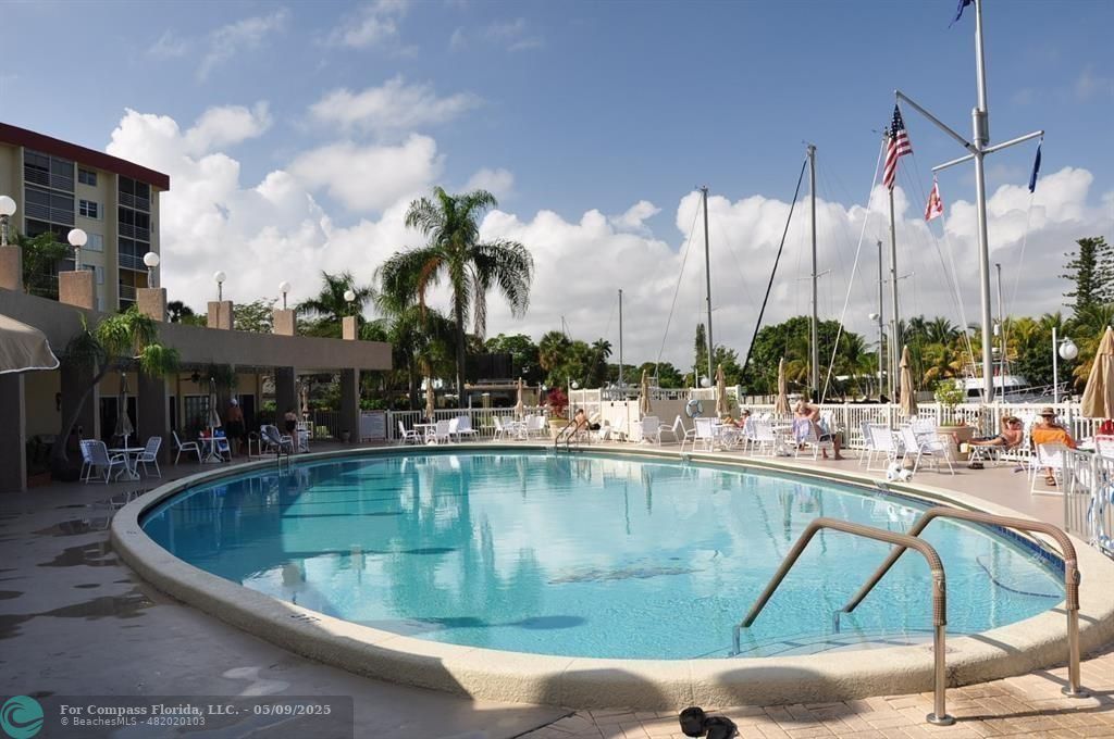 2731 Northeast 14th Street Causeway, Unit 612 Pompano Beach, FL 33062 - Photo 22 of 22 a view of swimming pool with outdoor seating