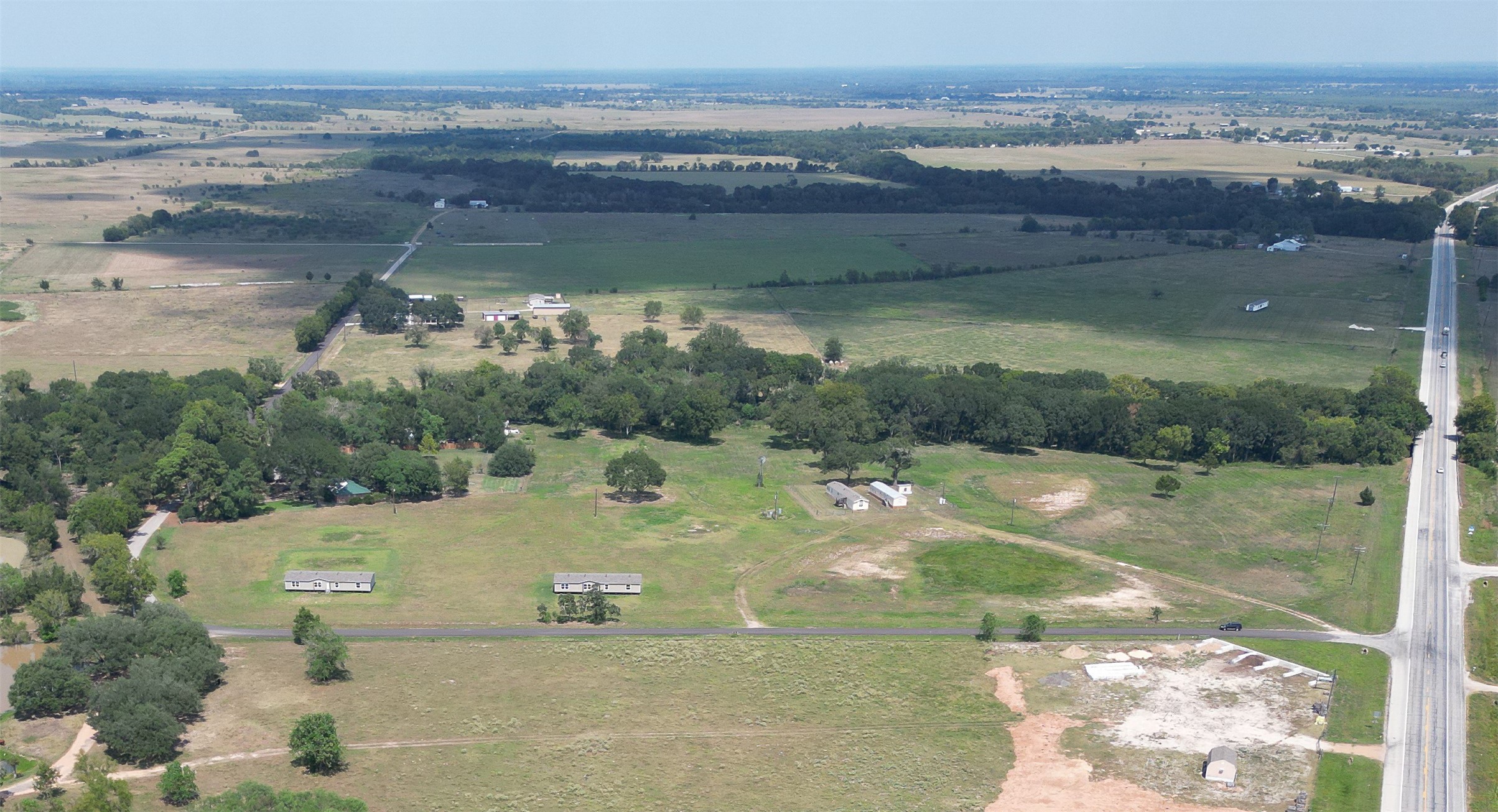 198 Langberg Road Bellville, TX 77418 - Photo 3 of 9 a view of a lake with a mountain
