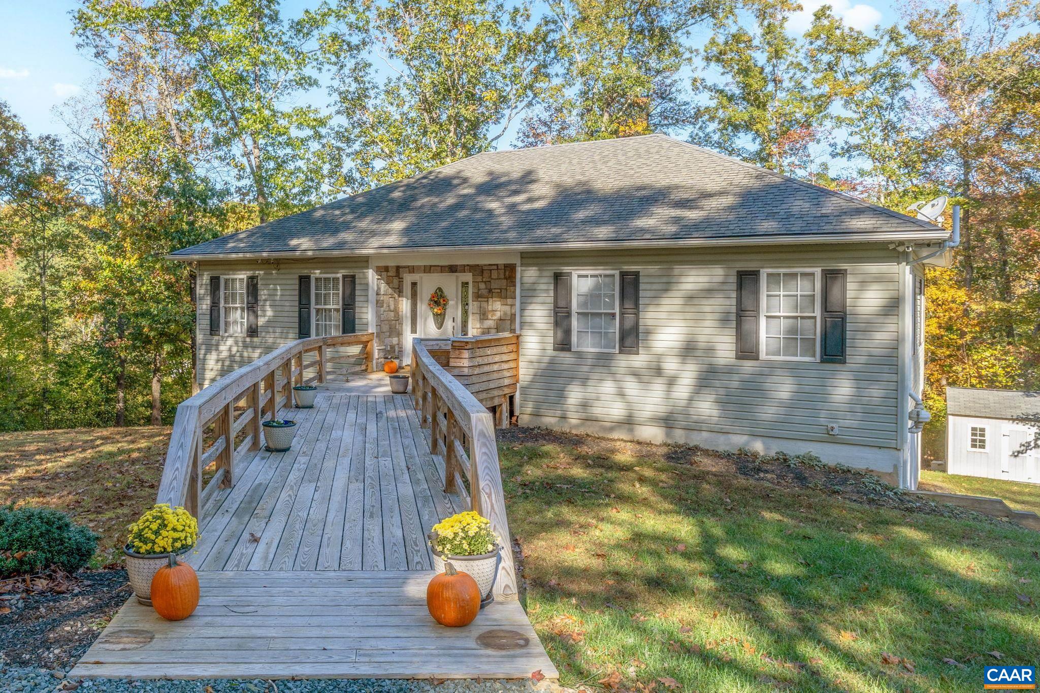 a front view of house with yard nad seating space