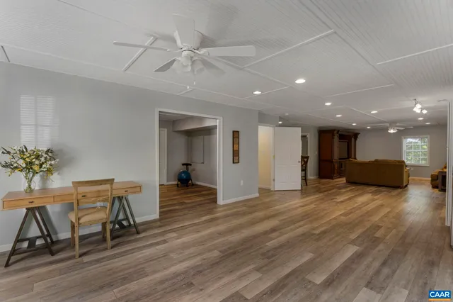 a backyard of a house with table and chairs