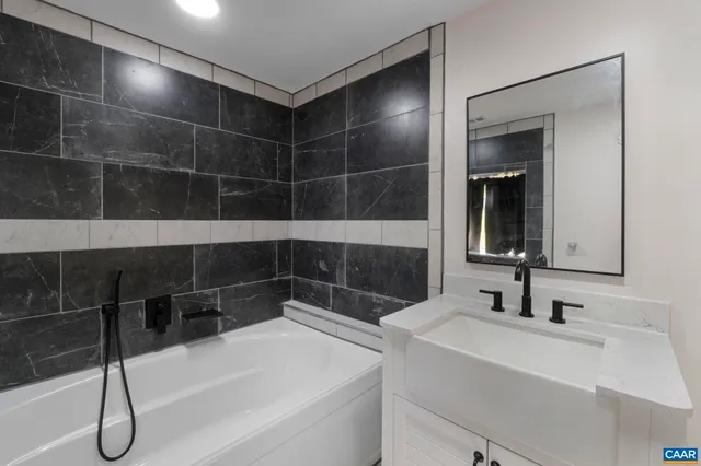 an aerial view of a houses with a yard