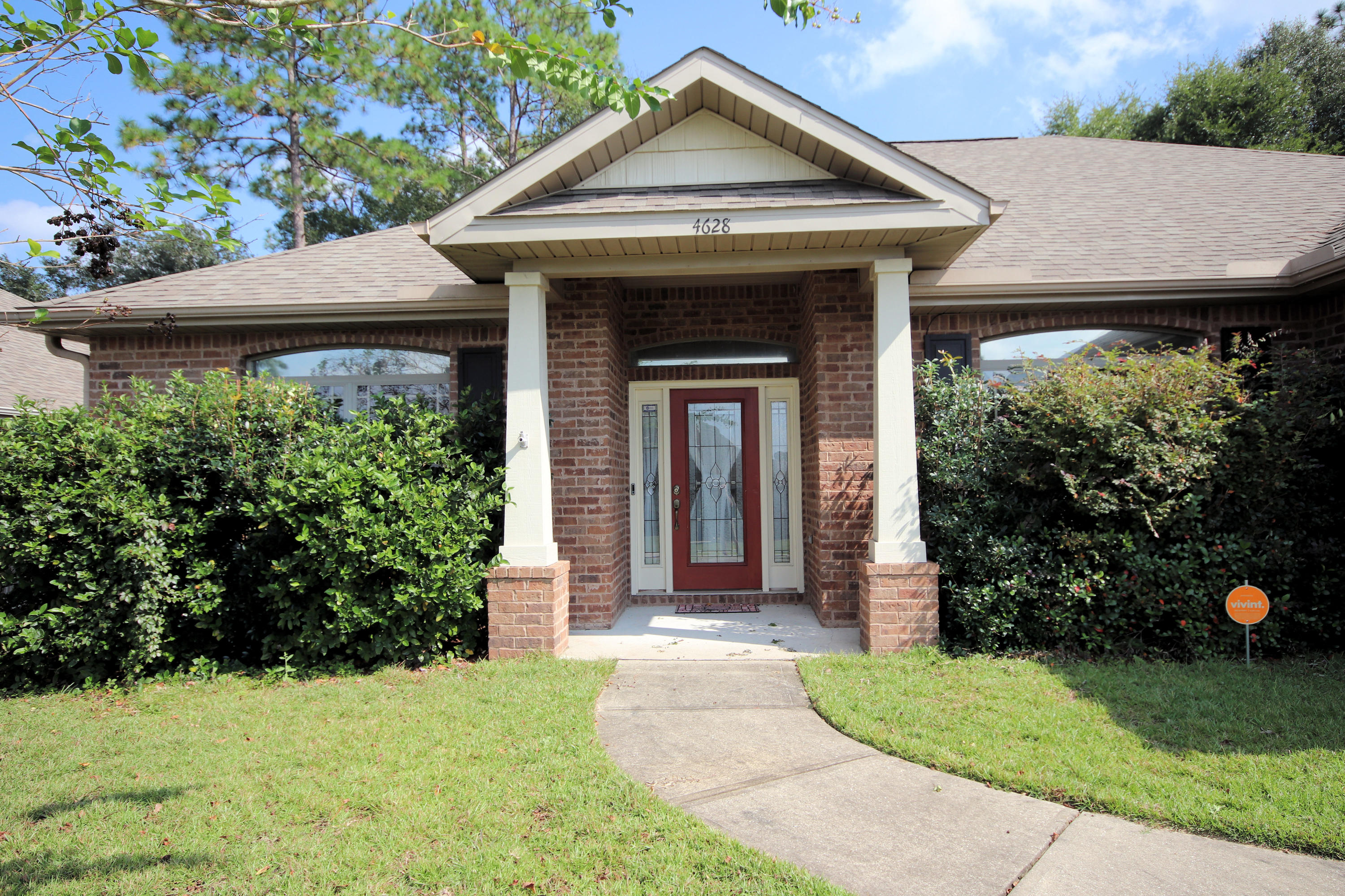 a front view of a house with a yard and porch