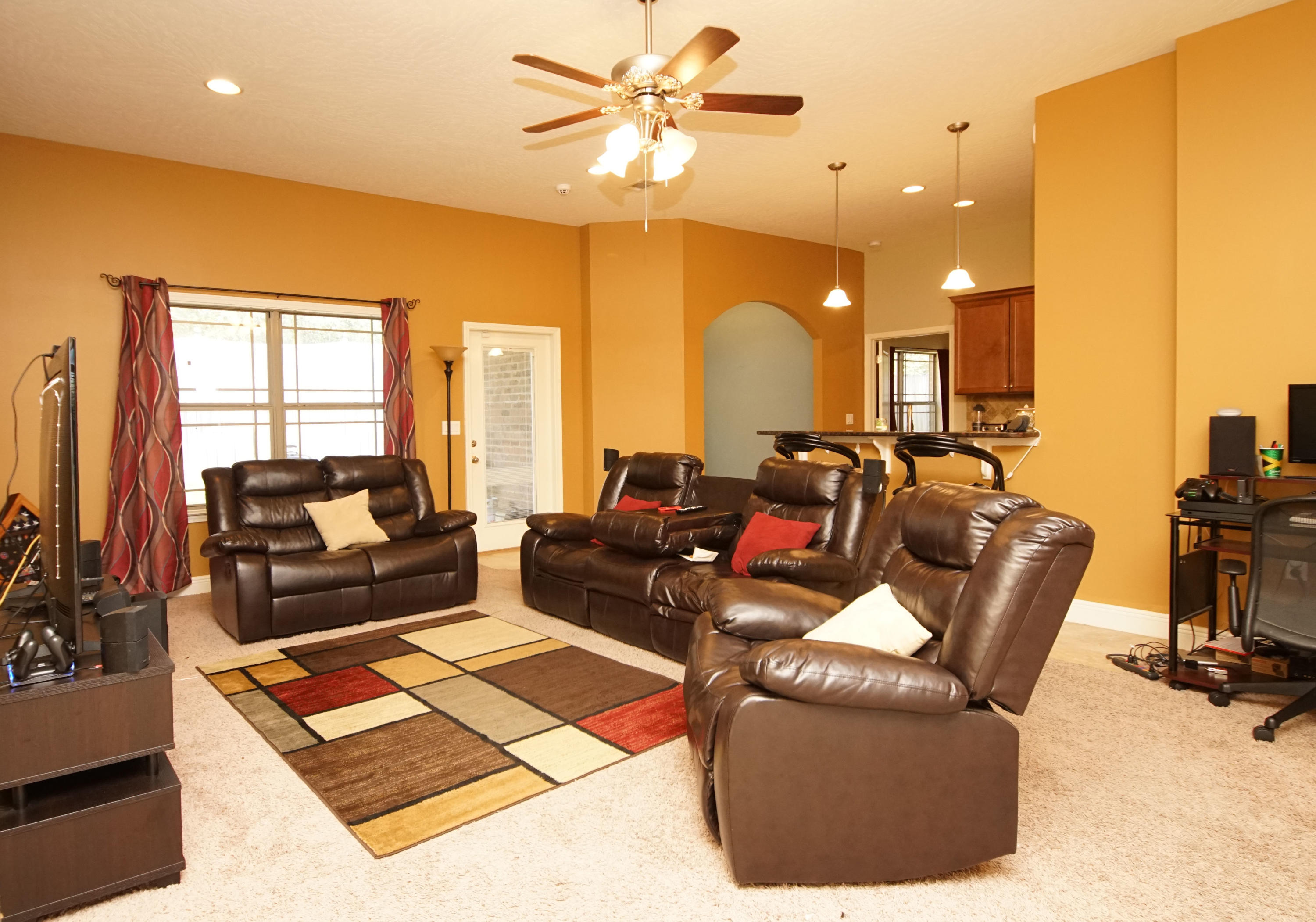 4628 Hermosa Road Crestview, FL 32539 - Photo 12 of 40 a living room with furniture and a chandelier