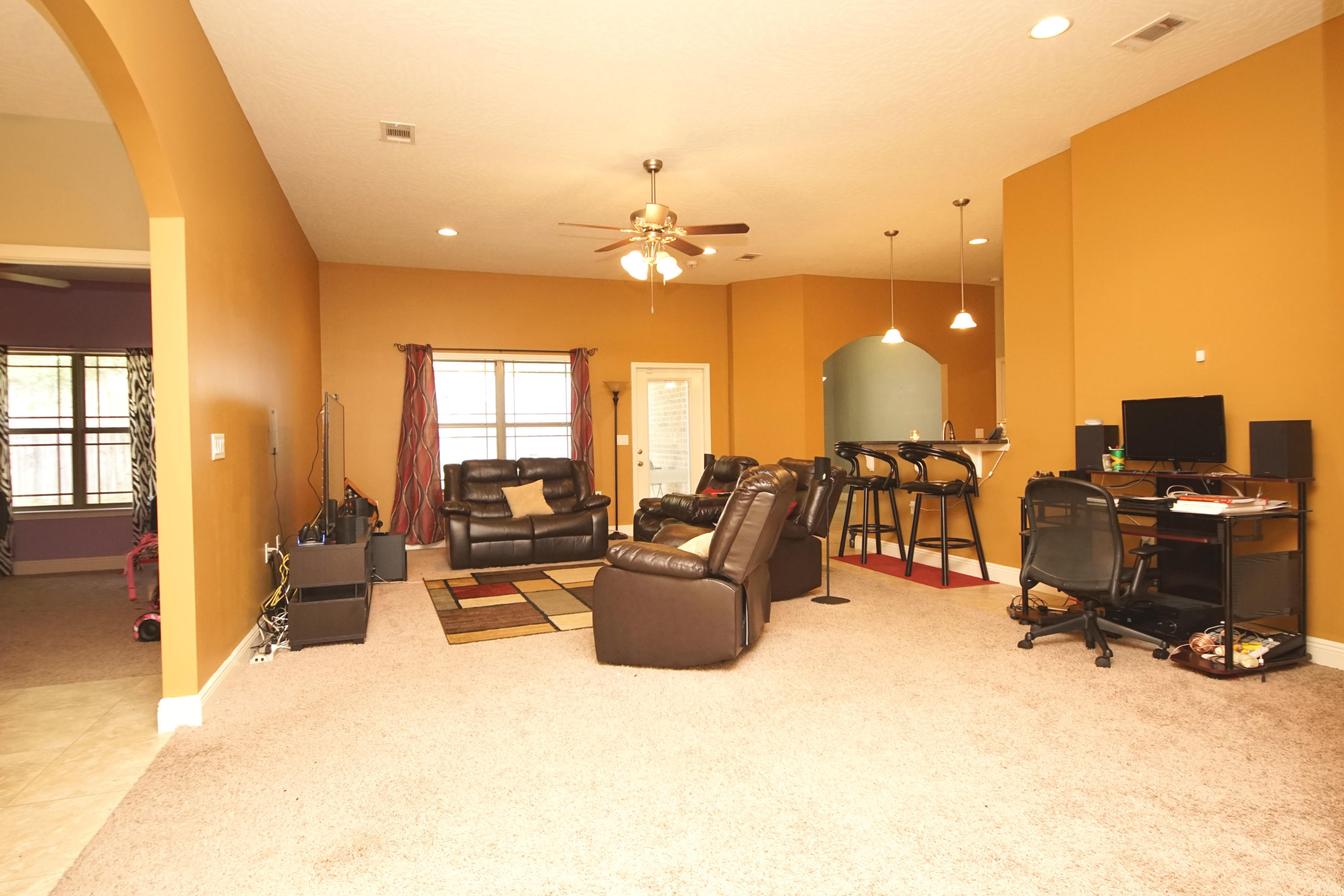 4628 Hermosa Road Crestview, FL 32539 - Photo 13 of 40 a living room with furniture and a flat screen tv