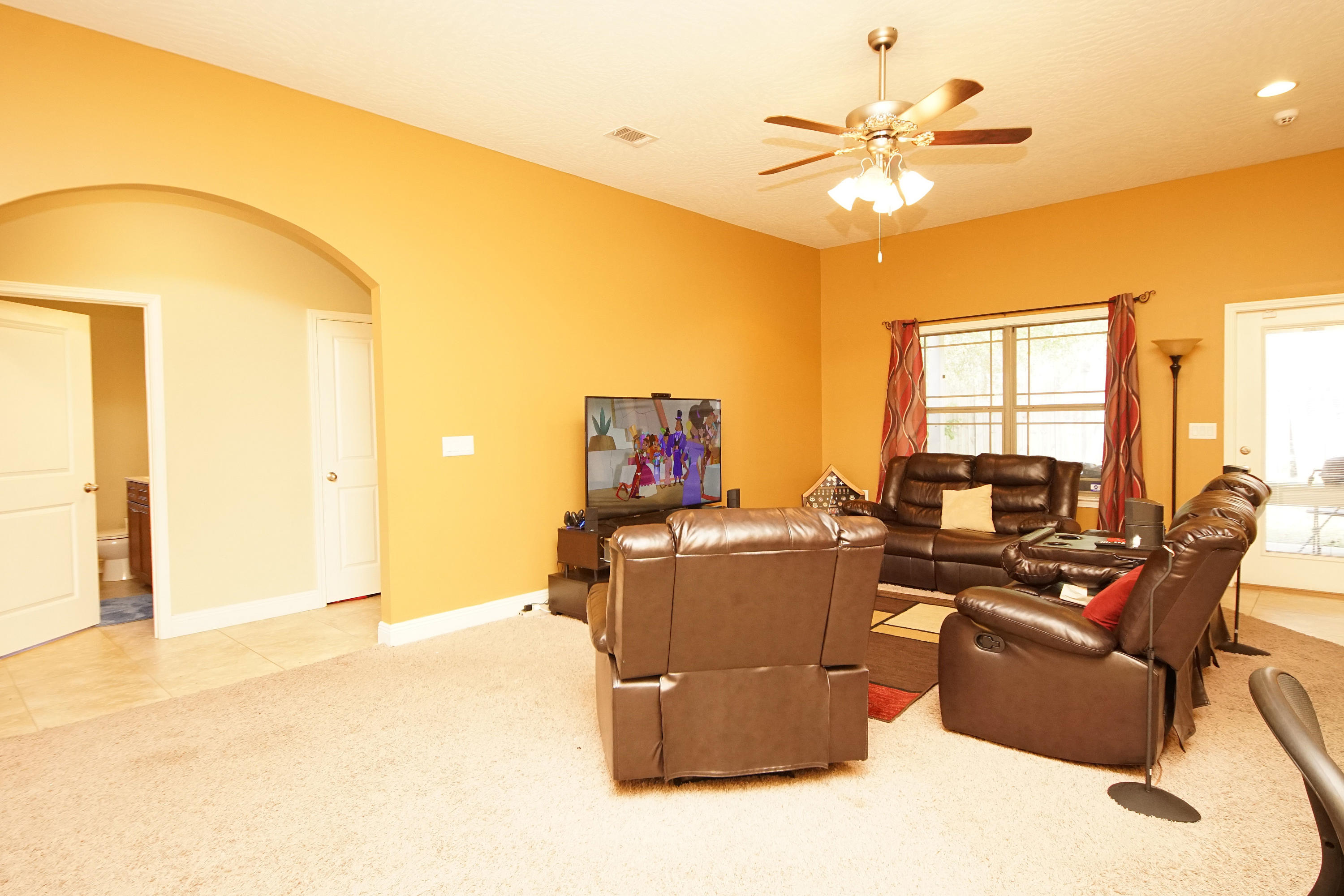 4628 Hermosa Road Crestview, FL 32539 - Photo 14 of 40 a living room with furniture and a large window