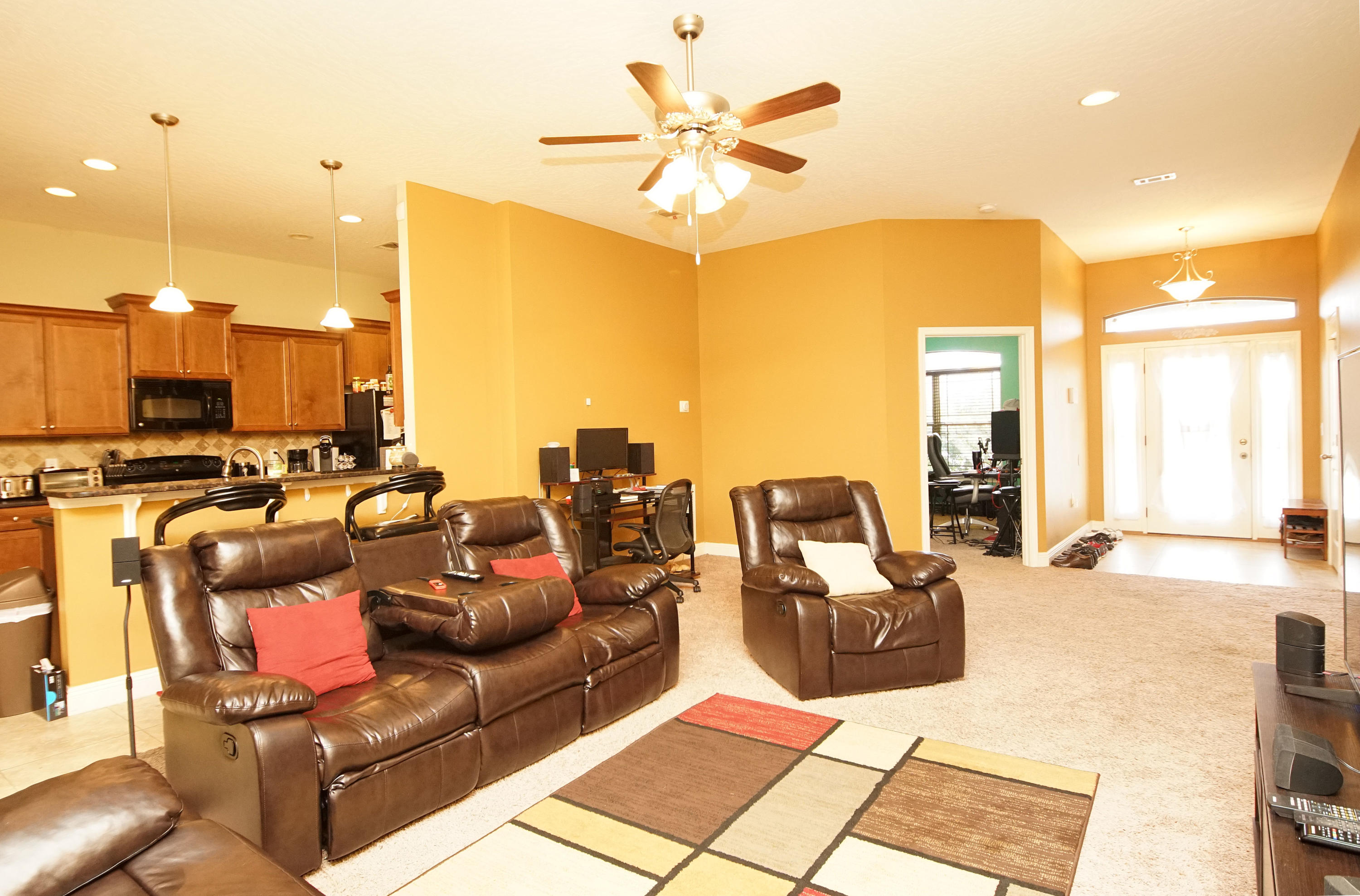 4628 Hermosa Road Crestview, FL 32539 - Photo 16 of 40 a living room with furniture and a chandelier