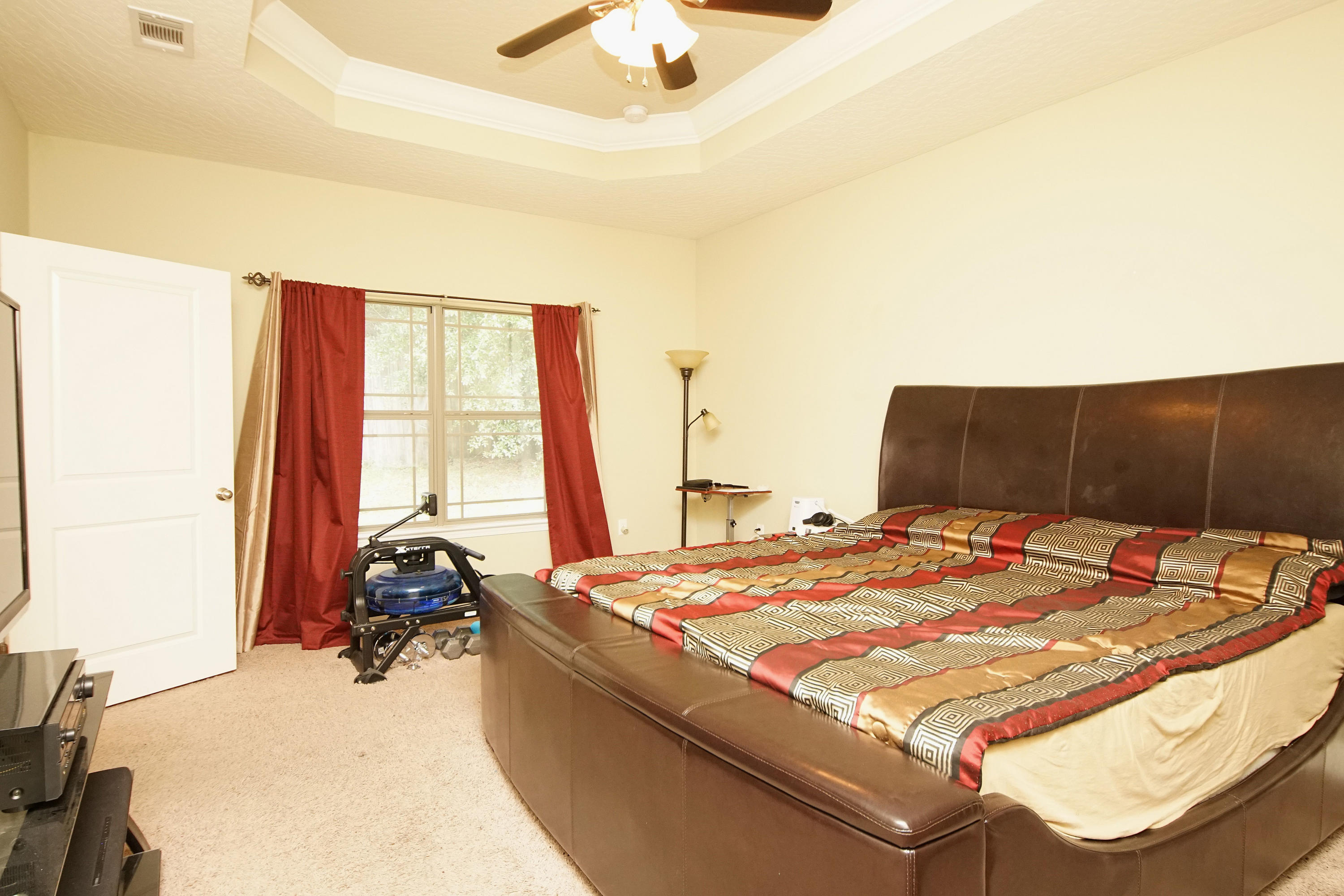 4628 Hermosa Road Crestview, FL 32539 - Photo 21 of 40 a bed sitting in a bedroom next to a window