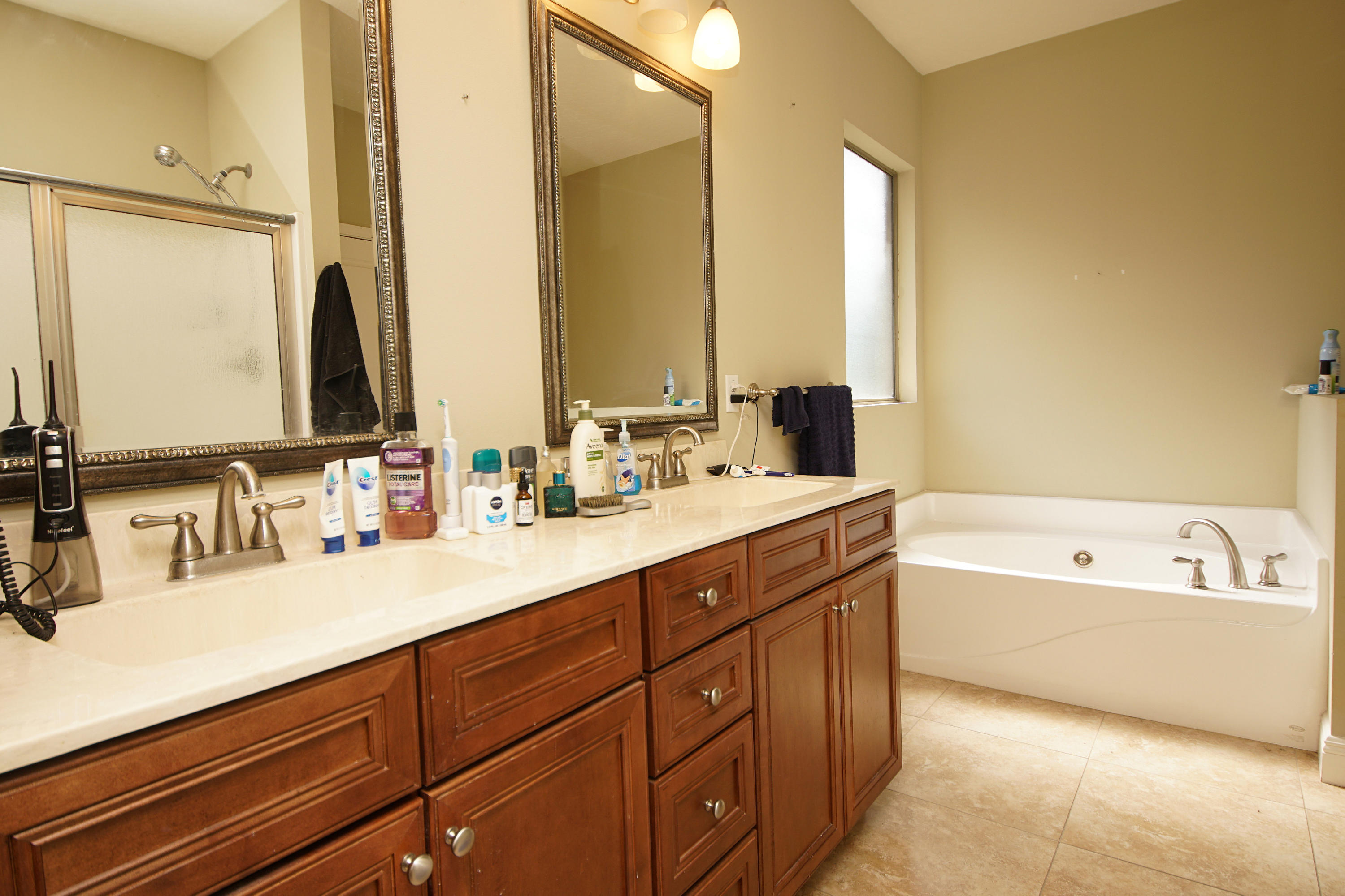 4628 Hermosa Road Crestview, FL 32539 - Photo 23 of 40 a bathroom with a double vanity sink mirror double and bathtub