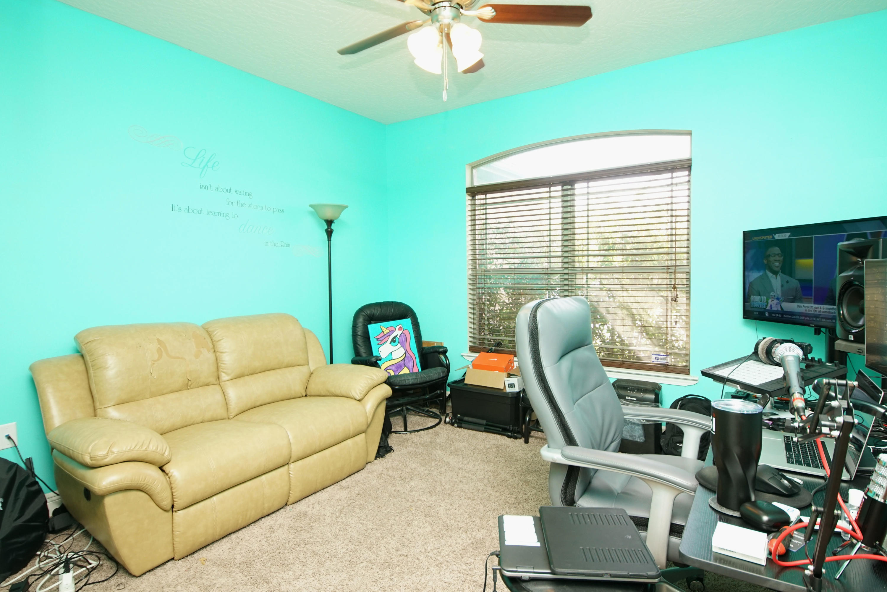 4628 Hermosa Road Crestview, FL 32539 - Photo 28 of 40 a living room with furniture a chandelier and a window