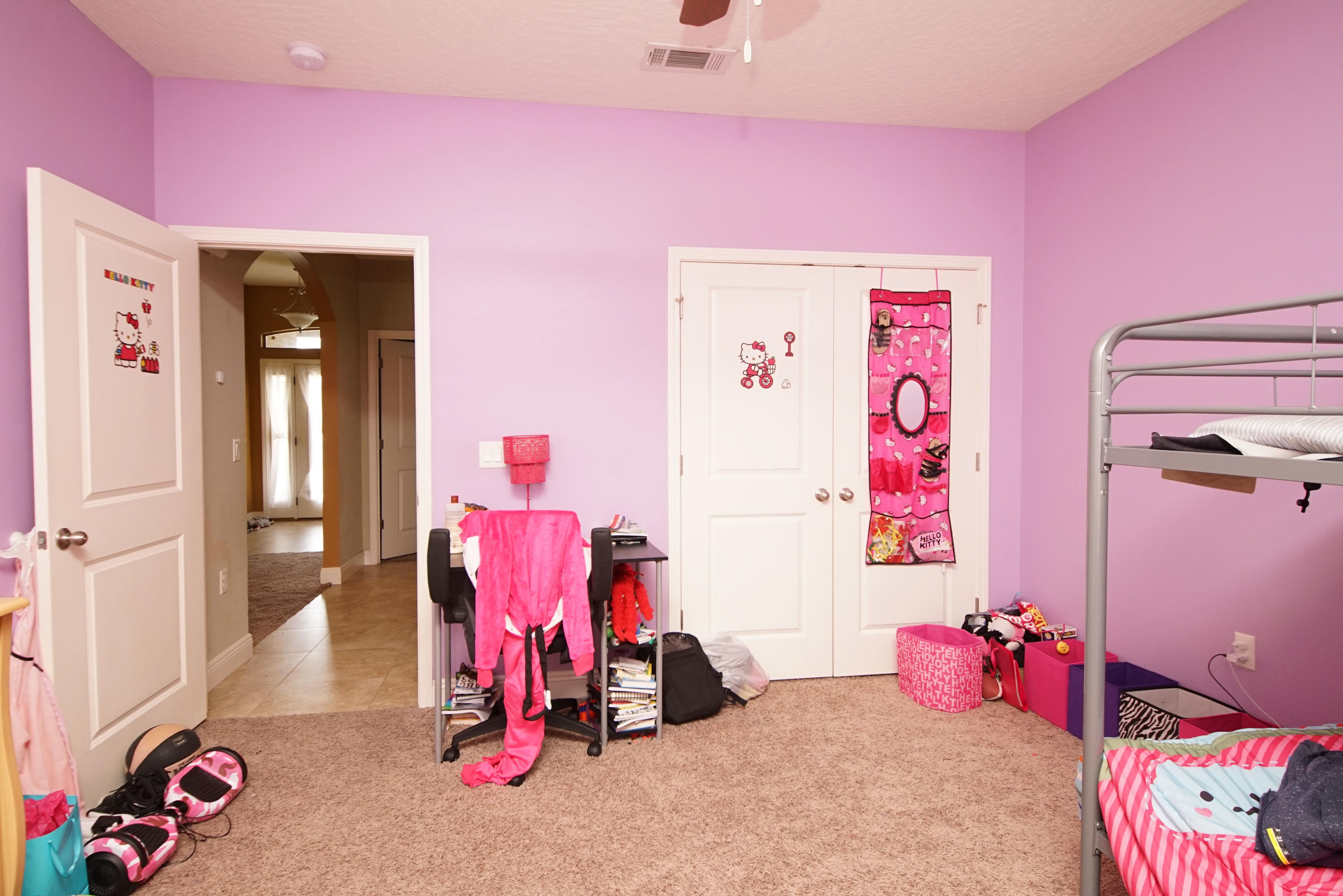 4628 Hermosa Road Crestview, FL 32539 - Photo 32 of 40 a bedroom with pink walls and furniture