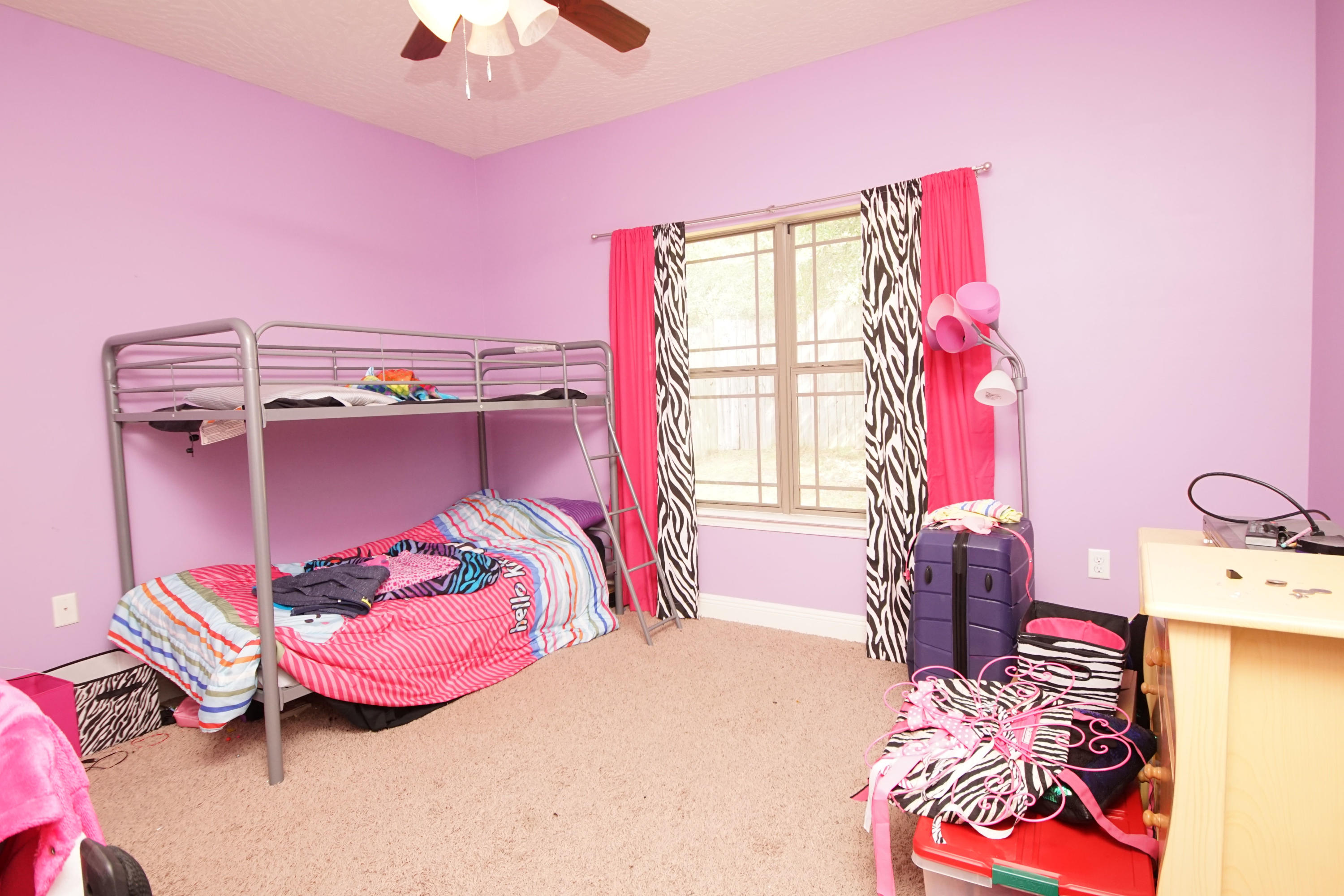 4628 Hermosa Road Crestview, FL 32539 - Photo 33 of 40 a bedroom with a bed and a window