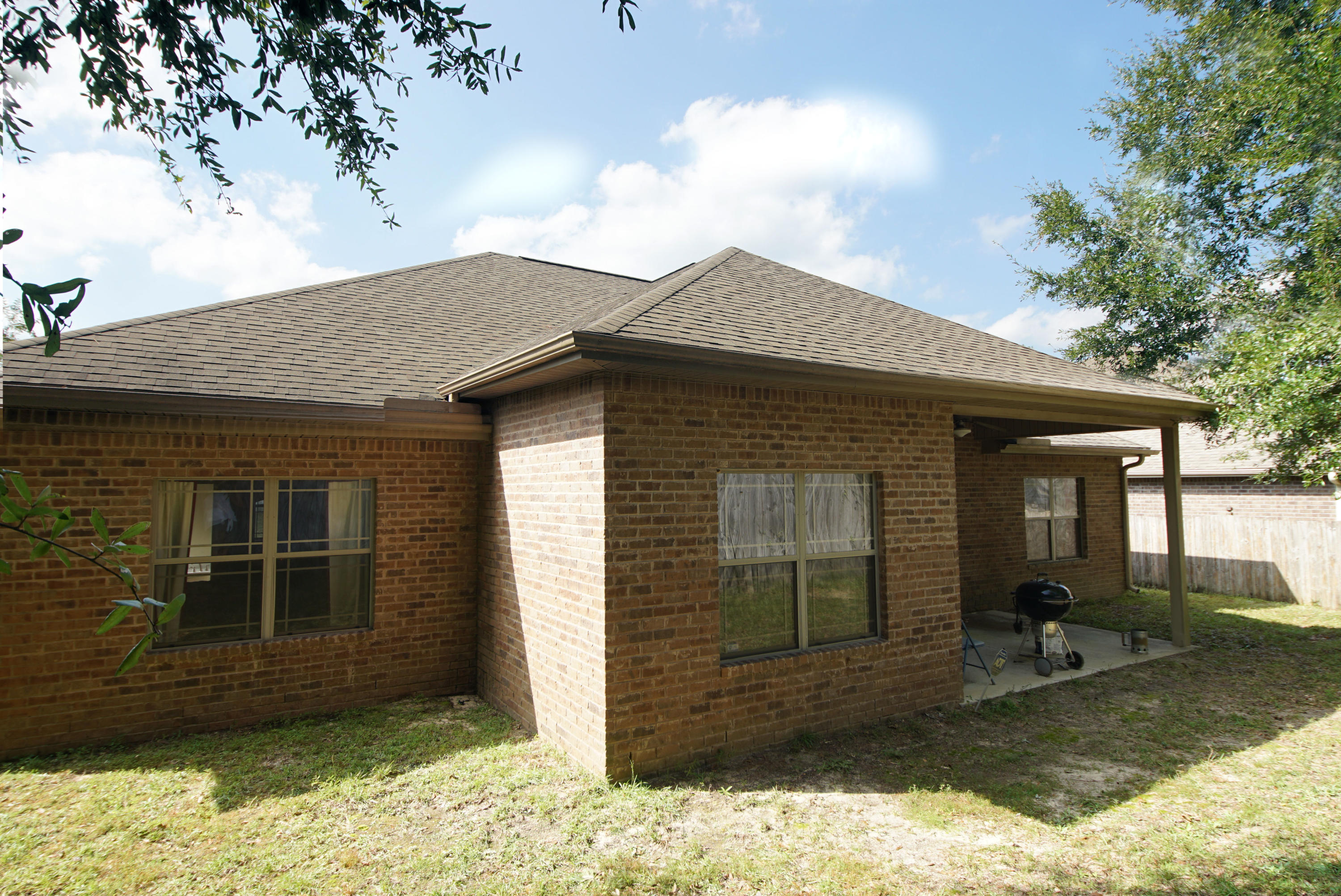 4628 Hermosa Road Crestview, FL 32539 - Photo 35 of 40 a view of house with backyard porch and outdoor space