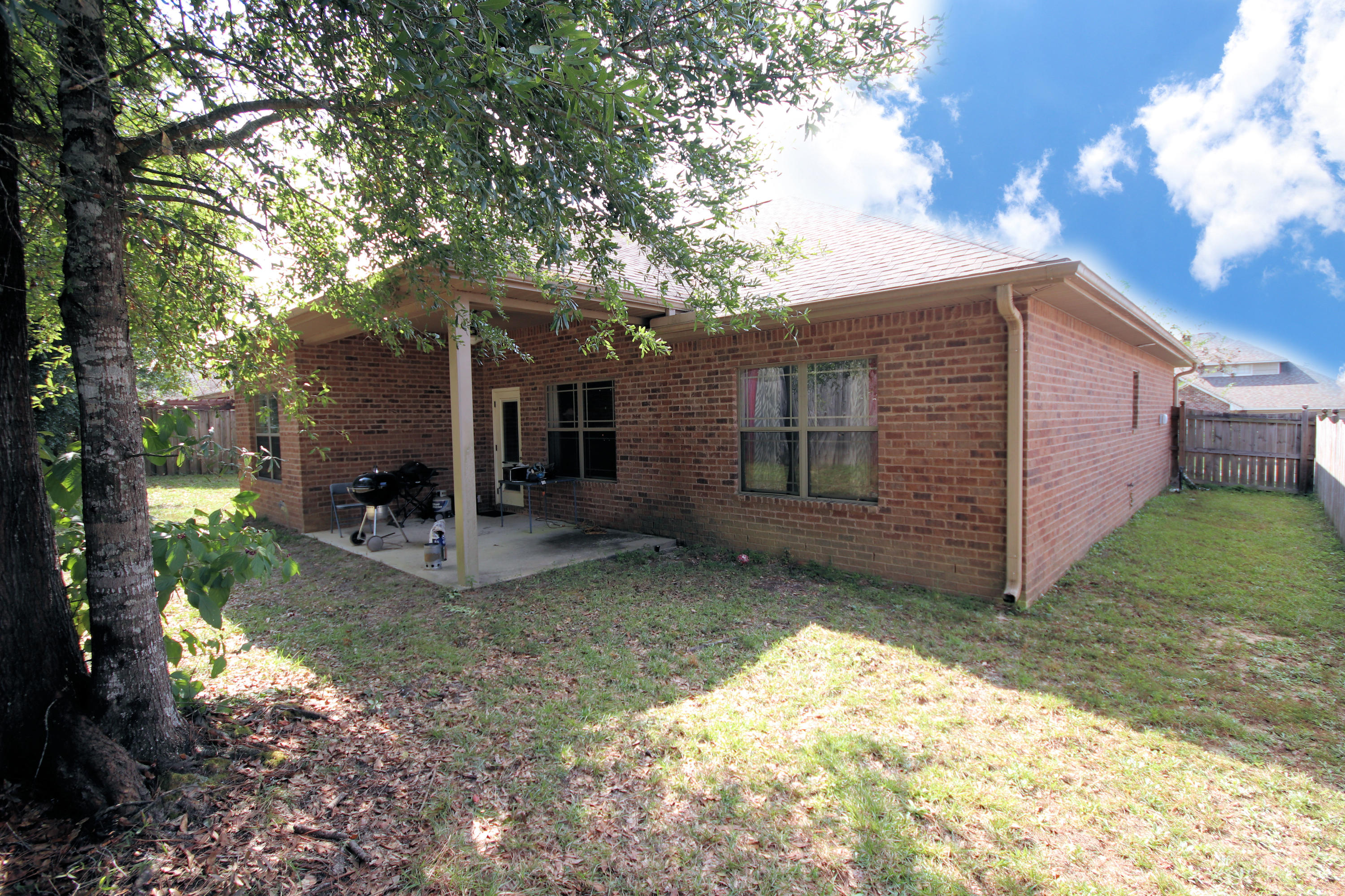 4628 Hermosa Road Crestview, FL 32539 - Photo 36 of 40 a view of a house with a yard