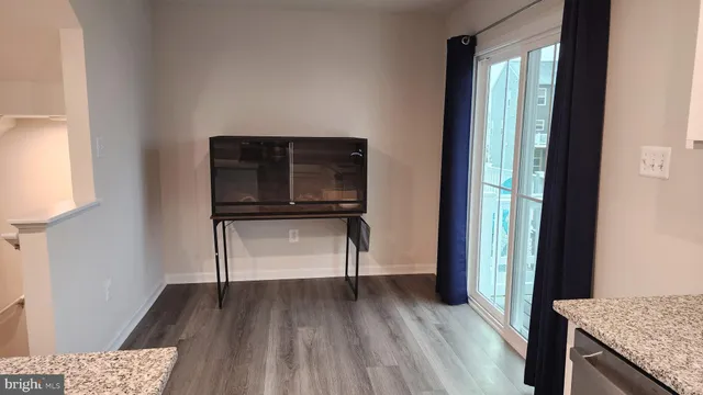 a view of hallway with wooden floor