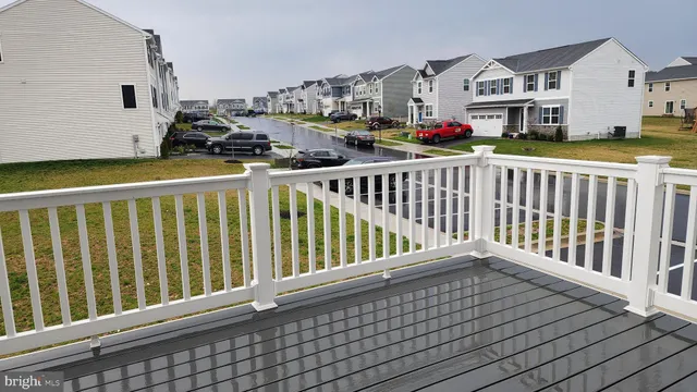 a view of balcony with wooden floor
