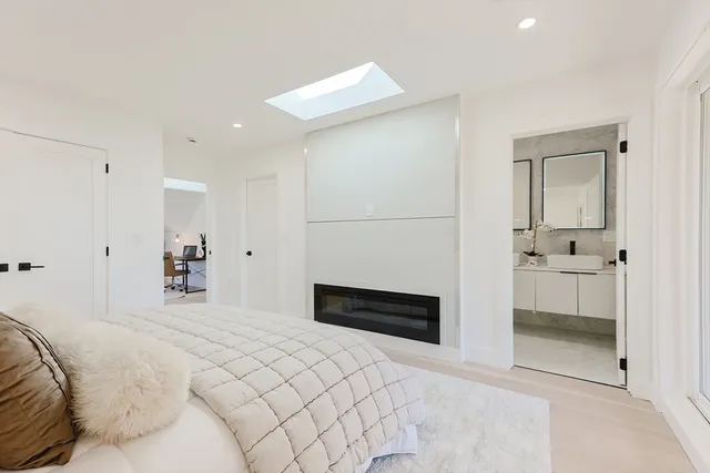 a bedroom with a bed and a view of bathroom