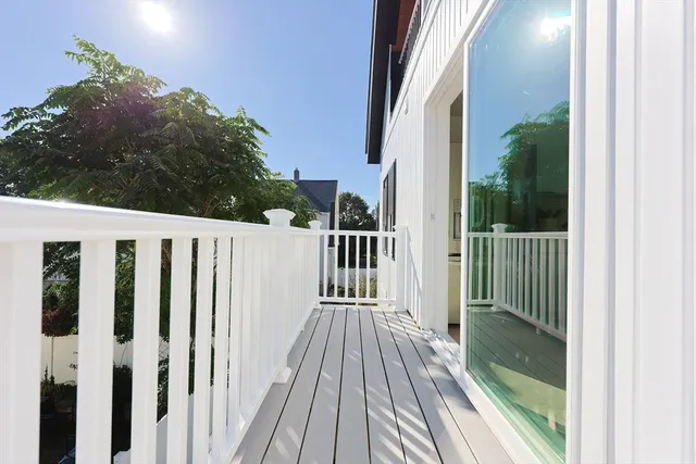 a view of a wooden house with a porch