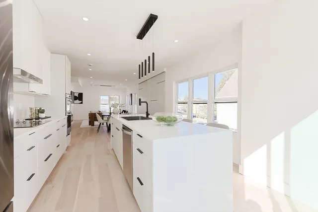 a kitchen with counter top space and cabinets