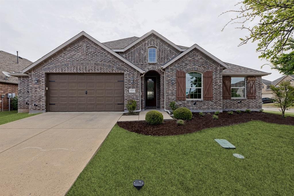 4136 Lightstone Lane Celina, TX 75009 - Photo 13 of 39 a front view of a house with a yard and garage