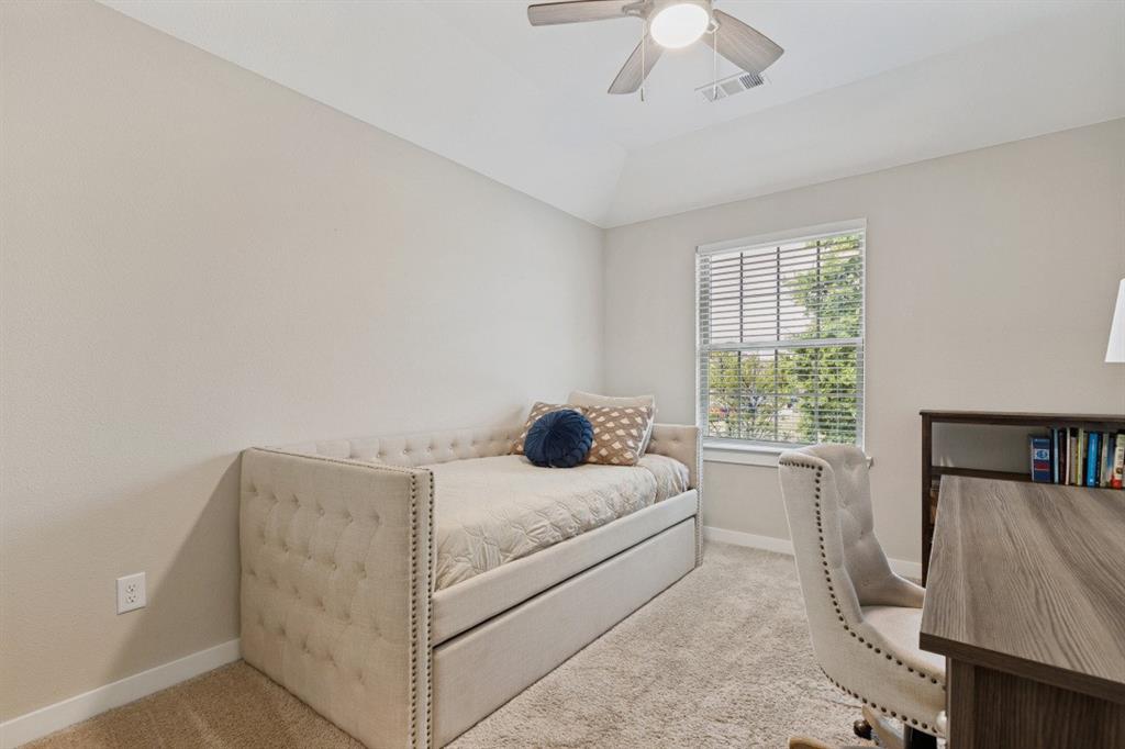 4136 Lightstone Lane Celina, TX 75009 - Photo 22 of 39 a bedroom with a bed and a window