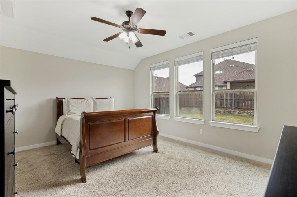 4136 Lightstone Lane Celina, TX 75009 - Photo 26 of 39 a bed room with a bed and a large window
