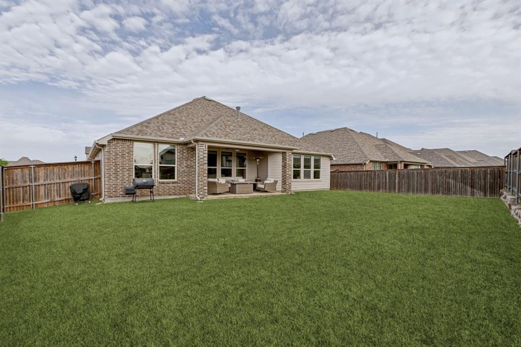 4136 Lightstone Lane Celina, TX 75009 - Photo 36 of 39 a view of a house with a big yard and large trees