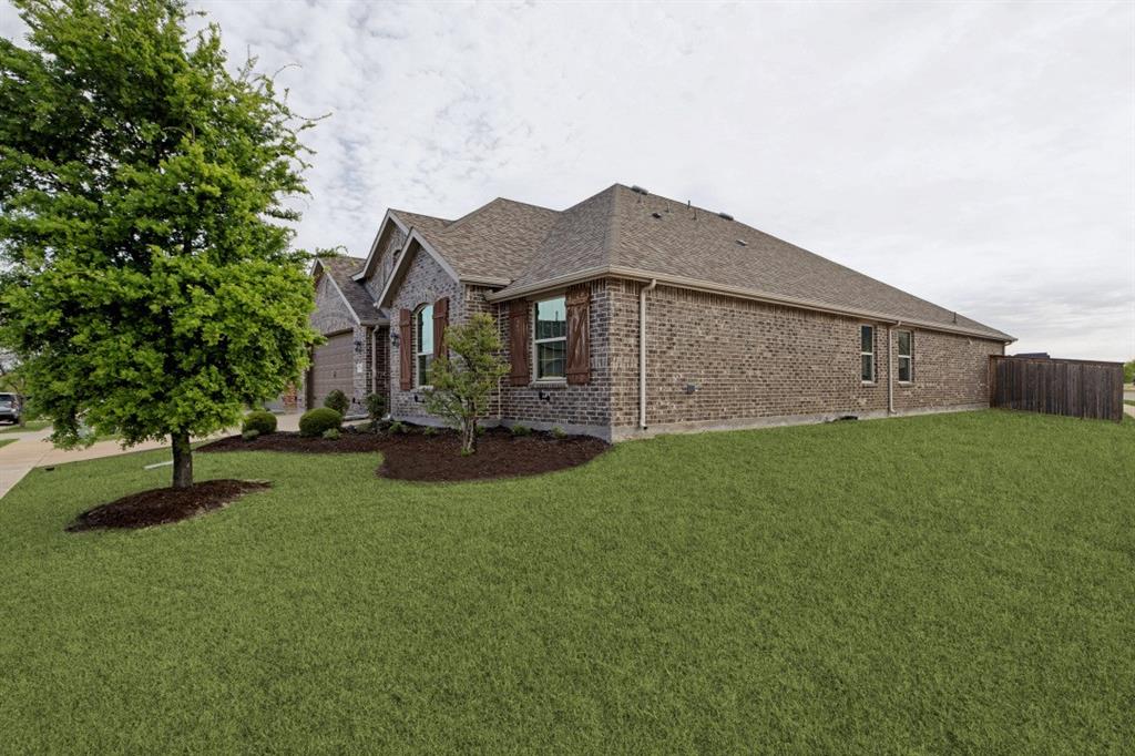 4136 Lightstone Lane Celina, TX 75009 - Photo 39 of 39 a front view of a house with garden