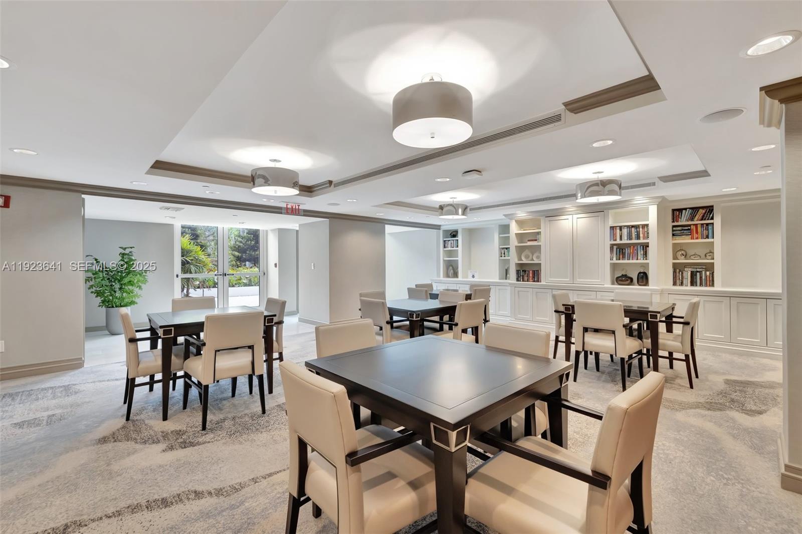 7000 Island Boulevard, Unit 1701 Aventura, FL 33160 - Photo 36 of 65 a view of a dining room with furniture and chandelier