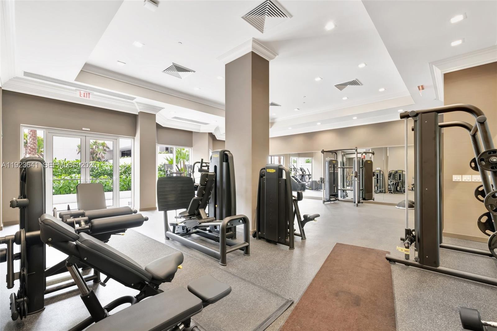 7000 Island Boulevard, Unit 1701 Aventura, FL 33160 - Photo 44 of 65 a view of a livingroom with furniture and floor to ceiling window
