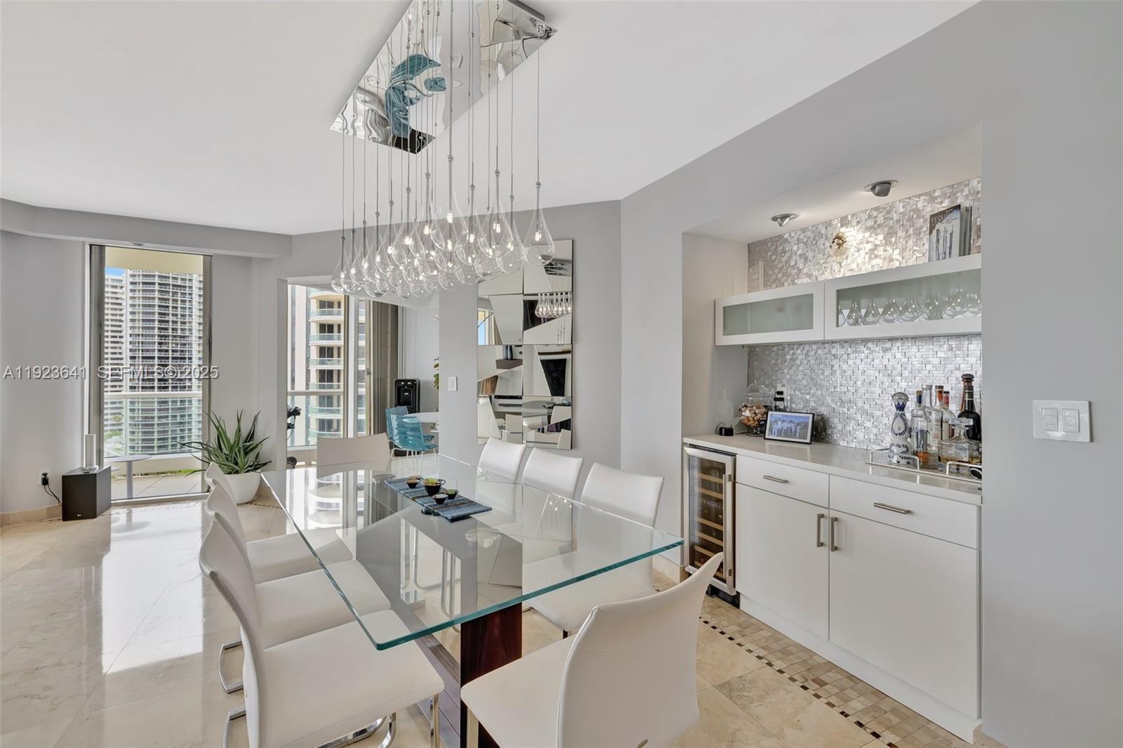 7000 Island Boulevard, Unit 1701 Aventura, FL 33160 - Photo 5 of 65 a view of a dining room with furniture window and outside view