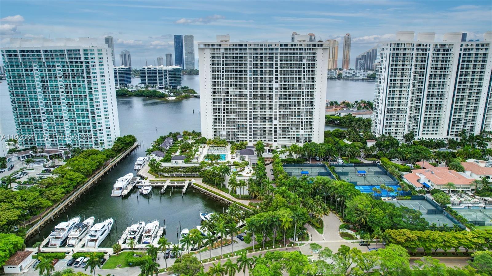 7000 Island Boulevard, Unit 1701 Aventura, FL 33160 - Photo 61 of 65 a view of a lake with tall buildings