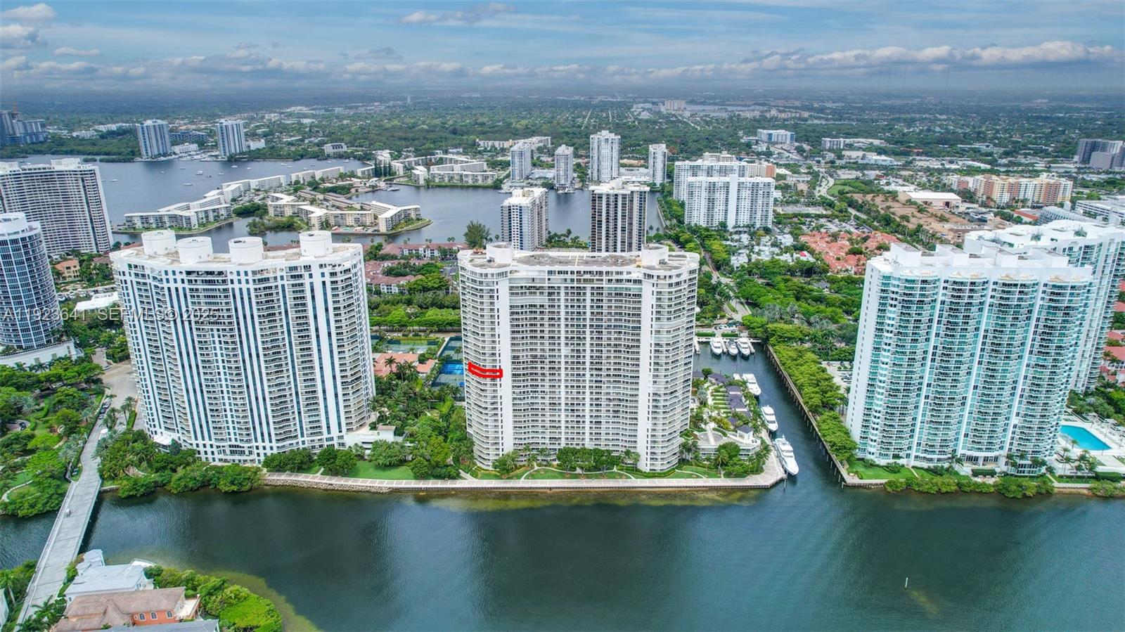 7000 Island Boulevard, Unit 1701 Aventura, FL 33160 - Photo 64 of 65 a view of a lake with tall buildings