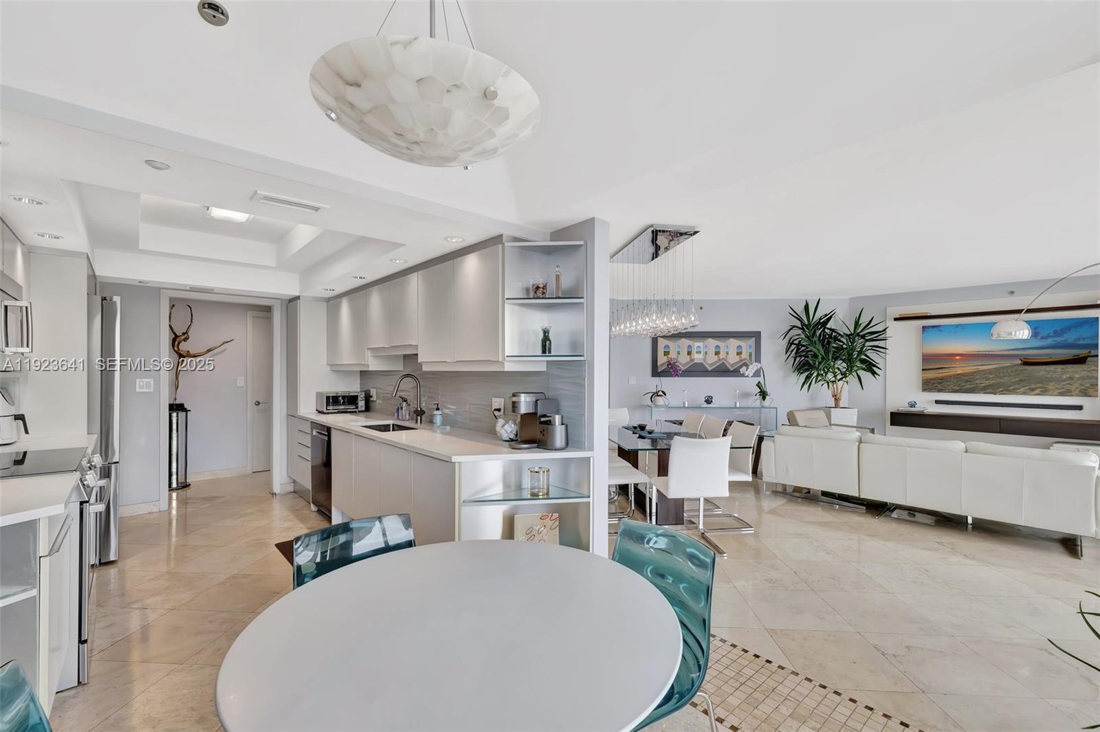 7000 Island Boulevard, Unit 1701 Aventura, FL 33160 - Photo 10 of 65 a living room with furniture and a wooden floor