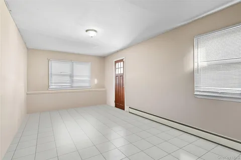 a bedroom with a bed and a chair