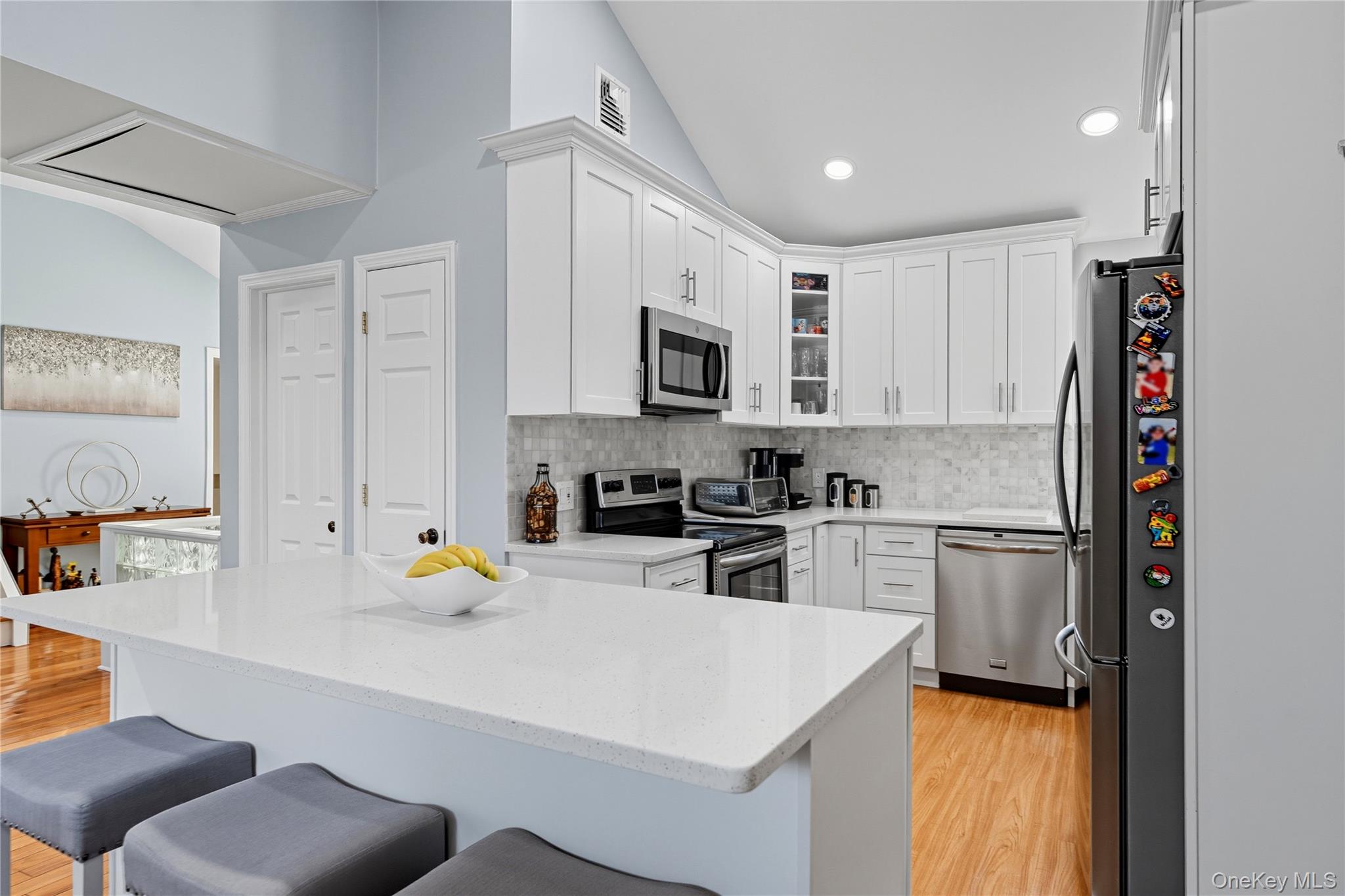 131 South 5th Street Bethpage, NY 11714 - Photo 8 of 21 a kitchen with a sink a stove and refrigerator