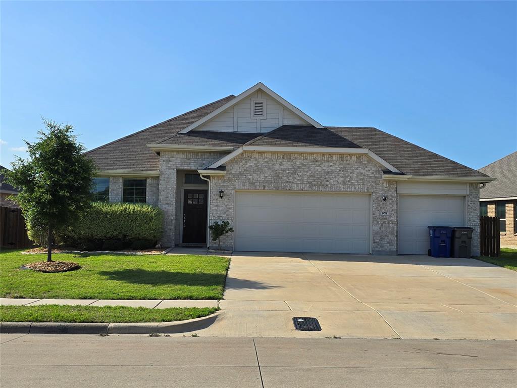 508 Williams Way Van Alstyne, TX 75495 - Photo 2 of 26 a front view of a house with a yard and garage