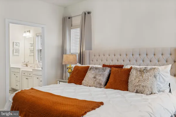 a bedroom with bed and window