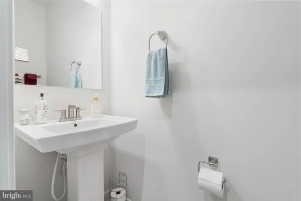 a bathroom with a sink and mirror