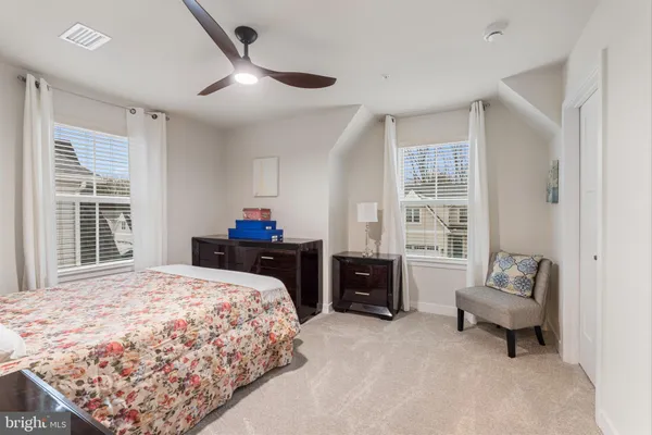 a bedroom with a bed and a couch