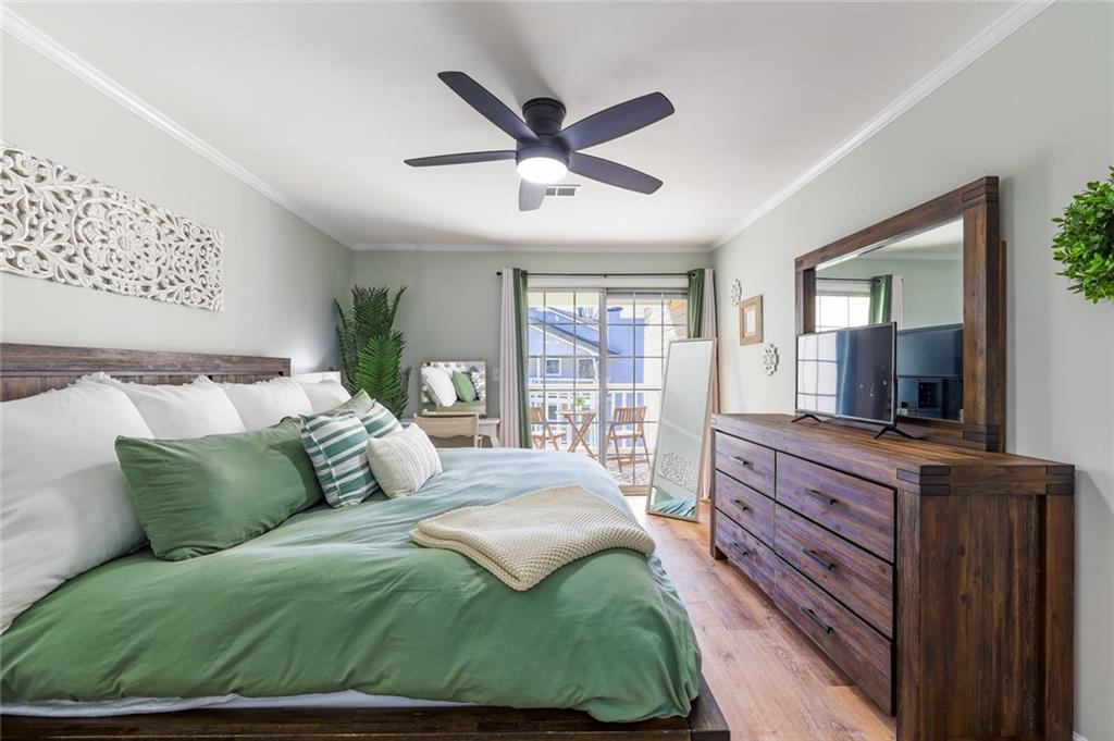 404 Countryside Place Smyrna, GA 30080 - Photo 18 of 36 a living room with a bed and a flat screen tv
