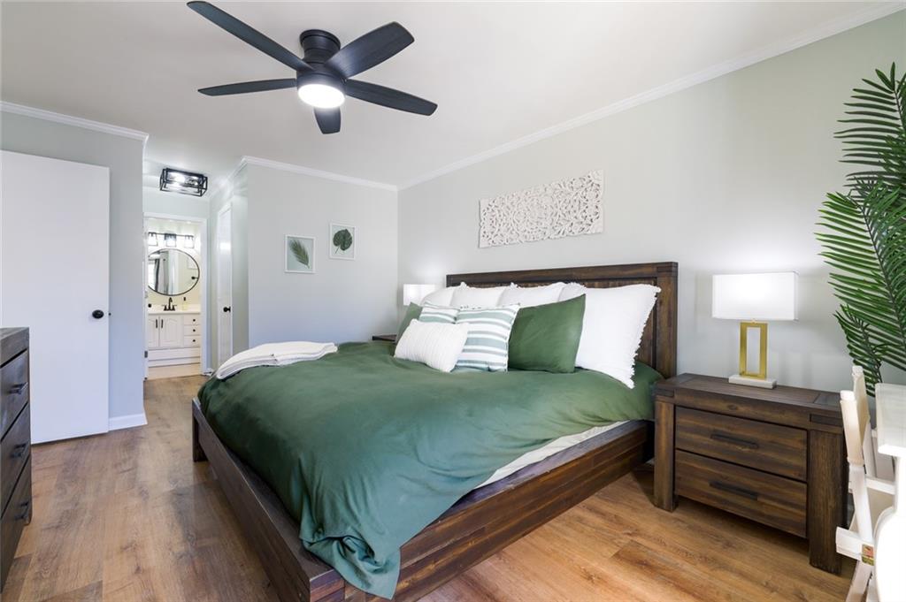 404 Countryside Place Smyrna, GA 30080 - Photo 19 of 36 a bedroom with a bed and a chandelier