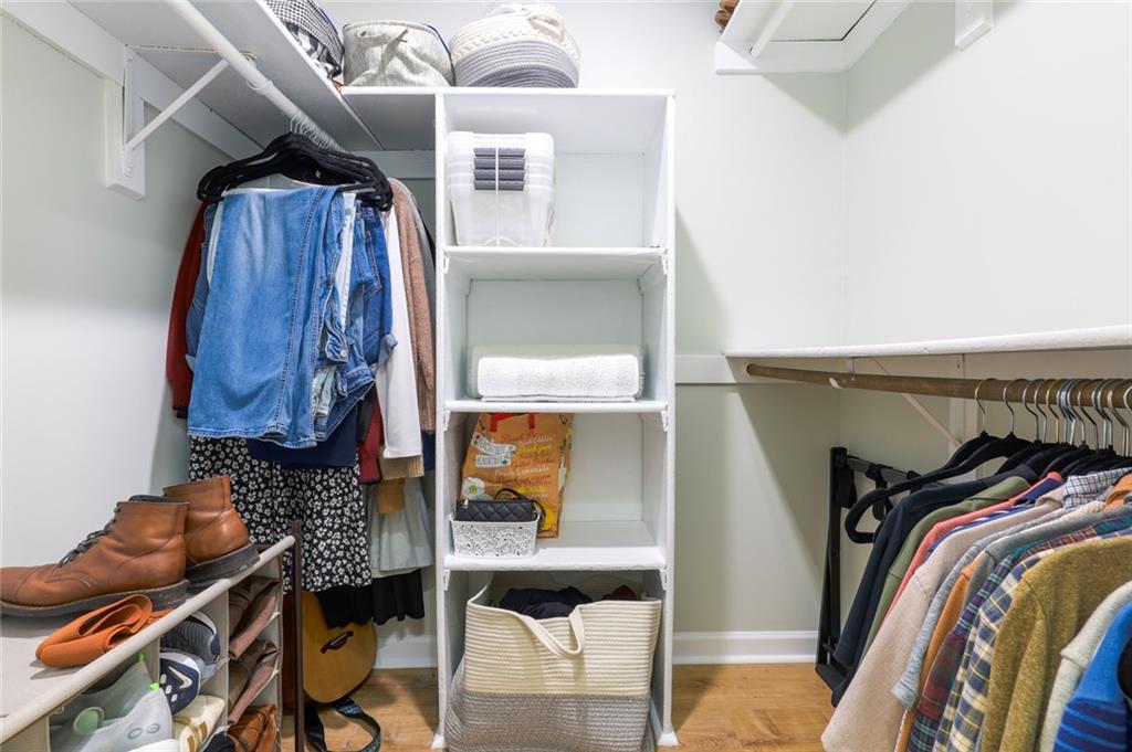 404 Countryside Place Smyrna, GA 30080 - Photo 20 of 36 a view of walk in closet with clothes and shoes