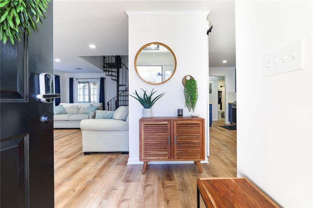 404 Countryside Place Smyrna, GA 30080 - Photo 2 of 36 a living room with furniture and a wooden floor