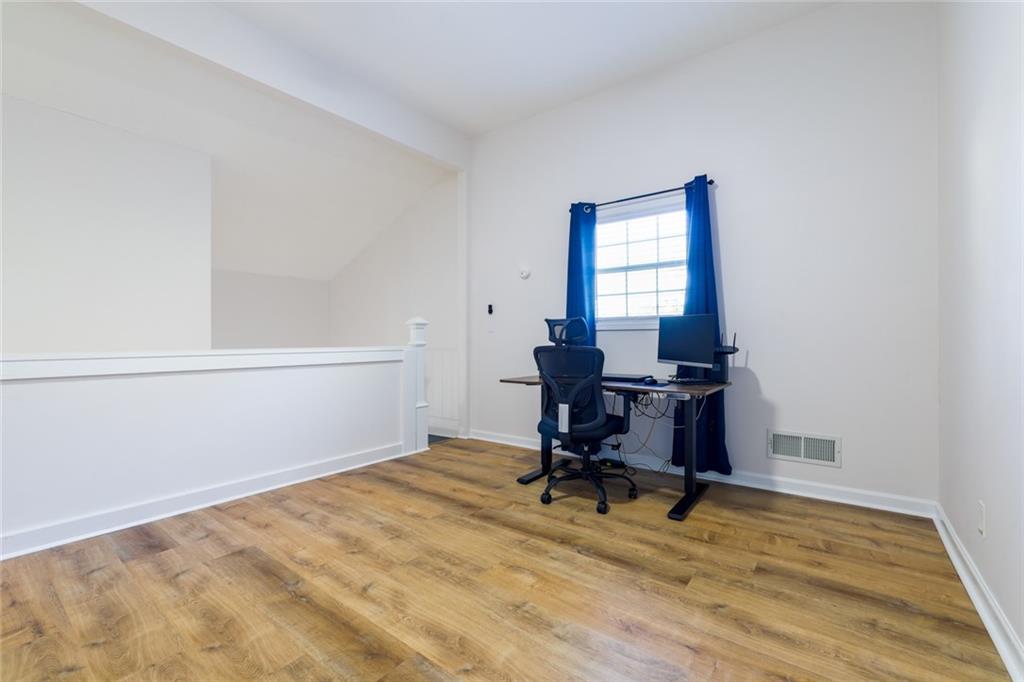 404 Countryside Place Smyrna, GA 30080 - Photo 27 of 36 a view of a workspace with furniture and a window