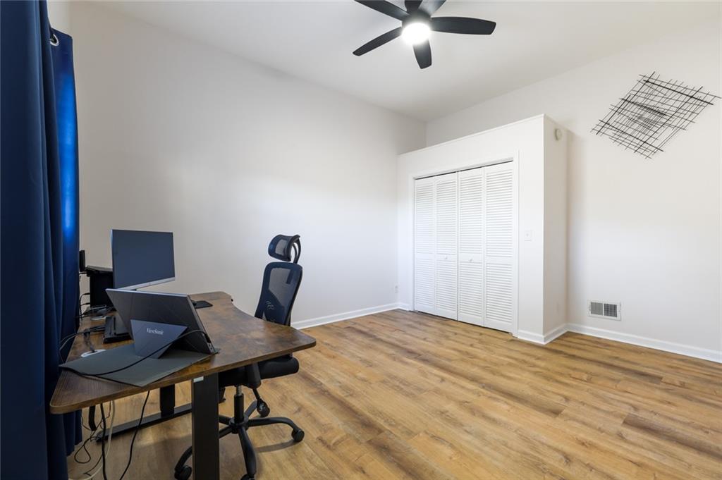 404 Countryside Place Smyrna, GA 30080 - Photo 28 of 36 a workspace with furniture and wooden floor