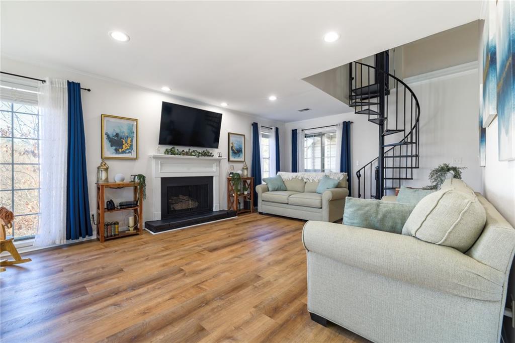 404 Countryside Place Smyrna, GA 30080 - Photo 3 of 36 a living room with furniture fireplace and flat screen tv